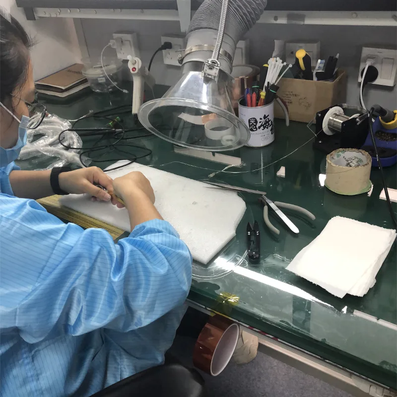 Technician assembling an ultrasound probe in the Akicare quality control workshop