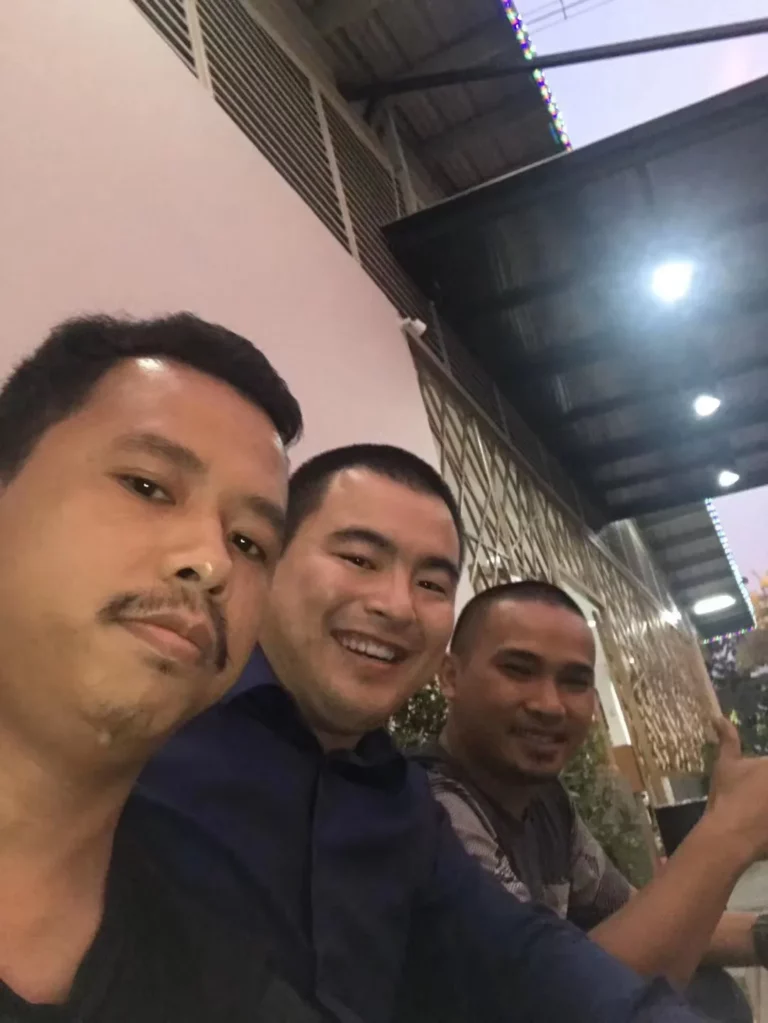 Akicare representative with business contacts during a visit