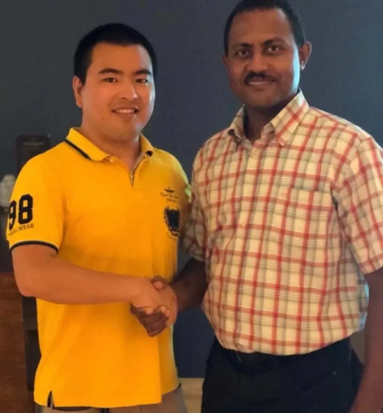 Akicare representative shaking hands with a business contact during a visit