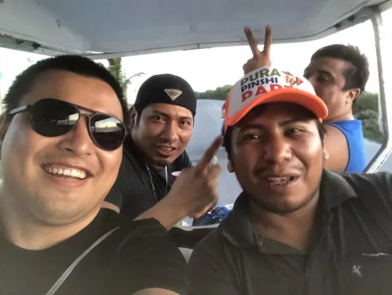 Akicare representative with business contacts in a vehicle during a visit