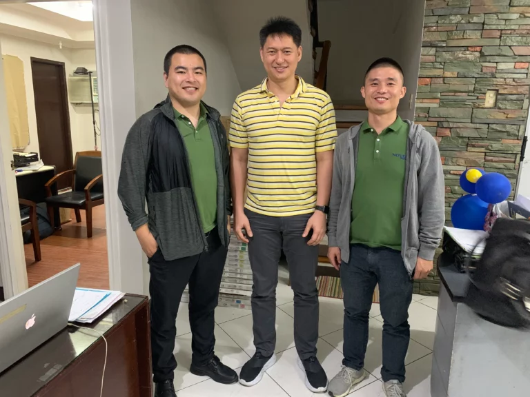 Akicare representative with business contacts in an office