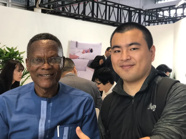 Akicare representative with a business contact at a medical imaging exhibition