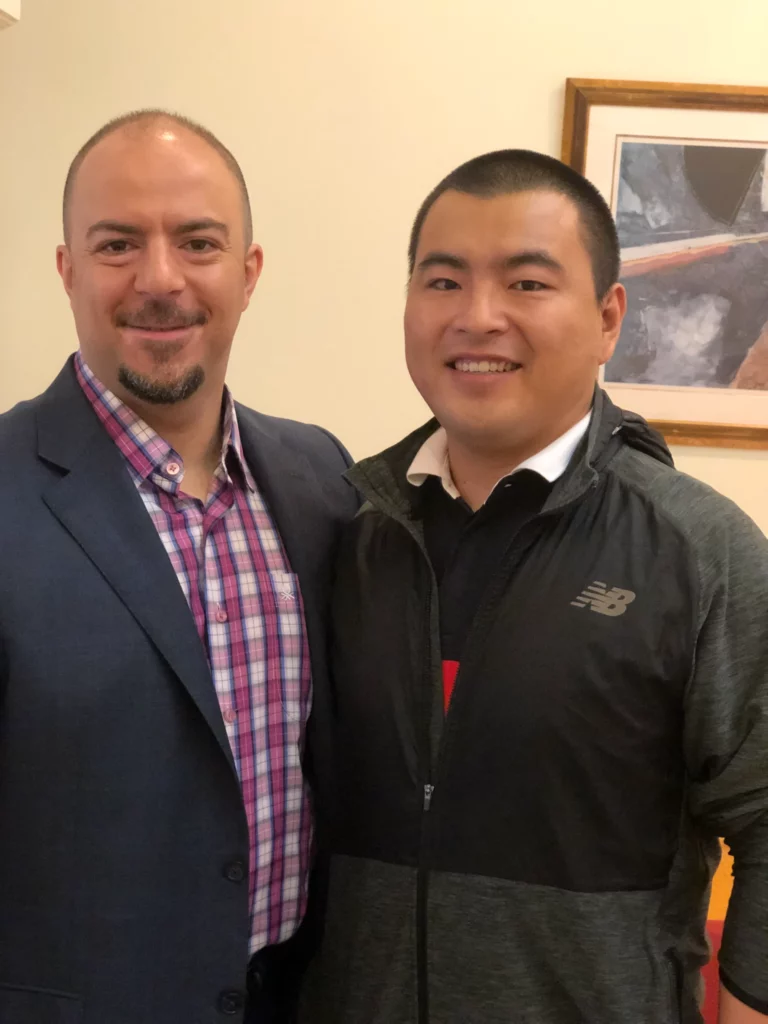 Akicare representative with a business contact during an in-person meeting