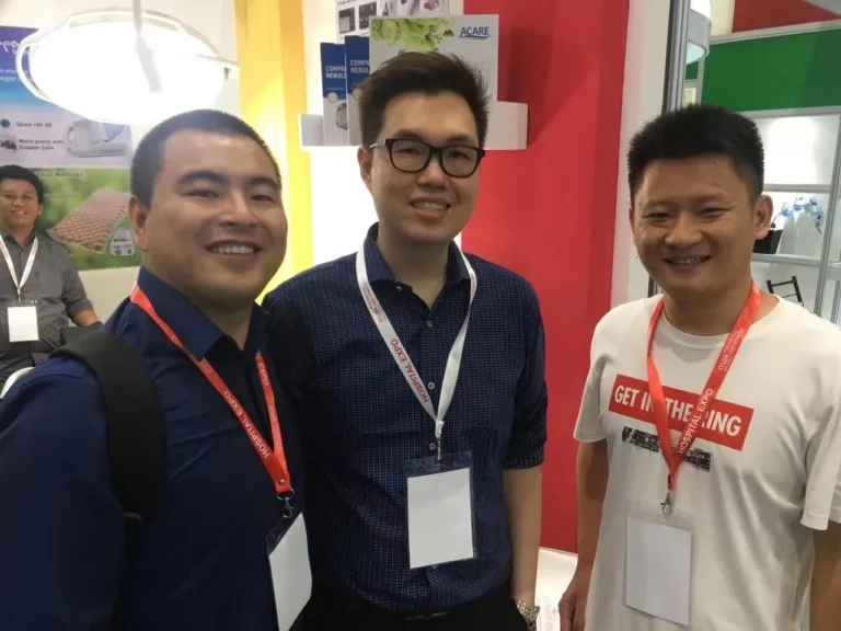 Akicare representative with business contacts at a medical imaging trade show