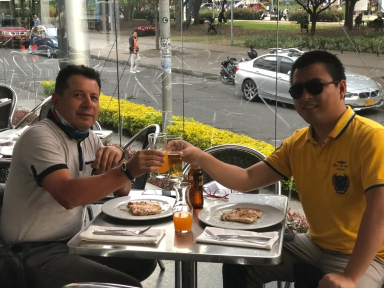 Akicare representative and a business contact at a restaurant table
