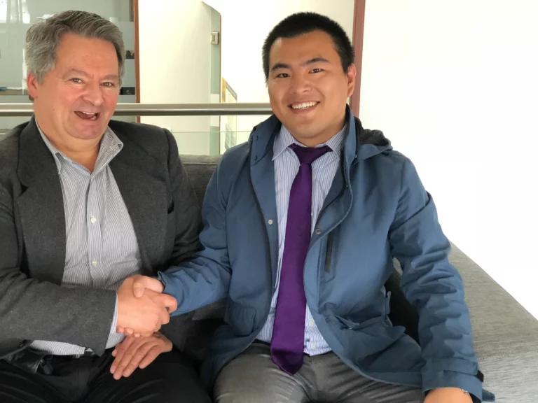 Akicare representative shaking hands with a business contact after a meeting