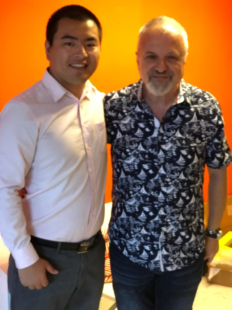 Akicare representative with a business contact during an in-person meeting