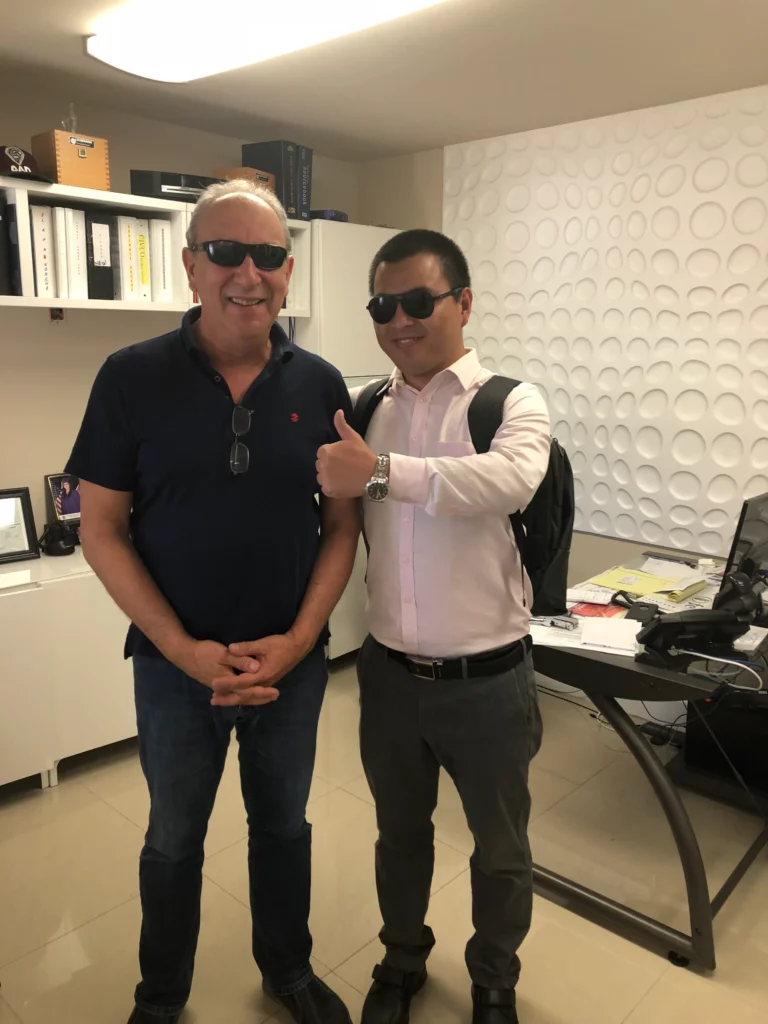 Akicare representative with a business contact in an office