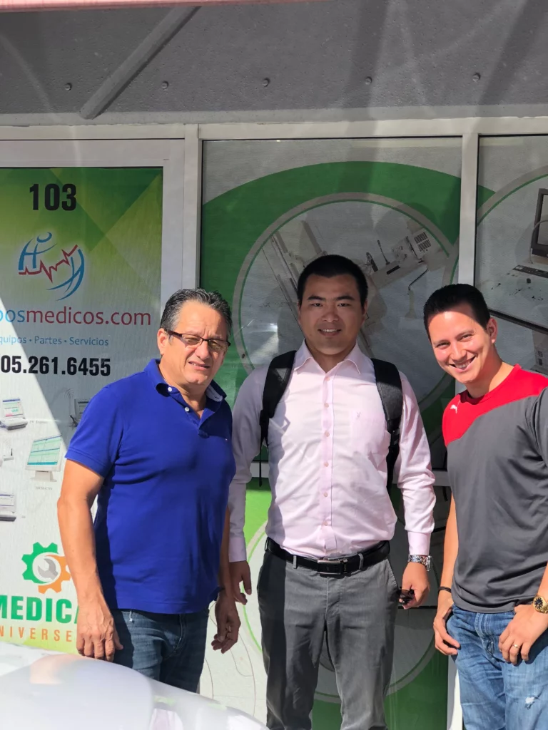 Akicare representative with business contacts outside a medical supplies office
