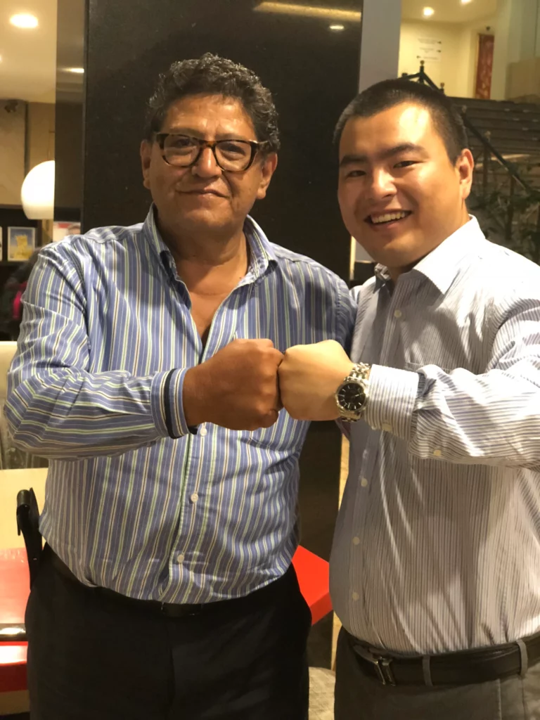 Akicare representative greeting a business contact during a visit
