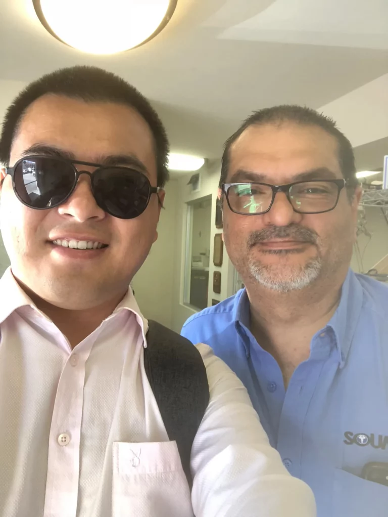 Akicare representative with a business contact during a visit