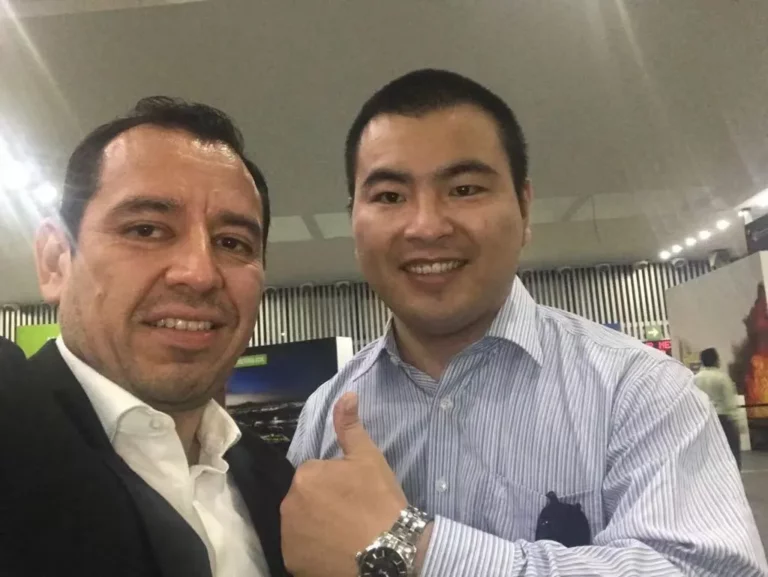 Akicare representative with a business contact during an in-person meeting