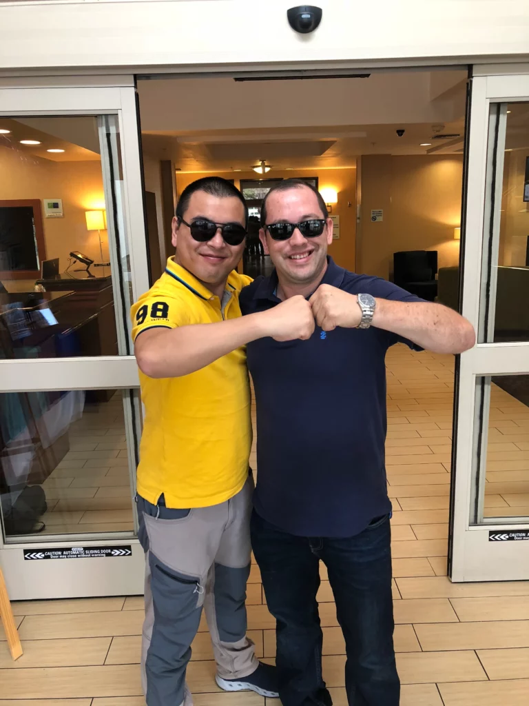 Akicare representative greeting a business contact at a hotel entrance
