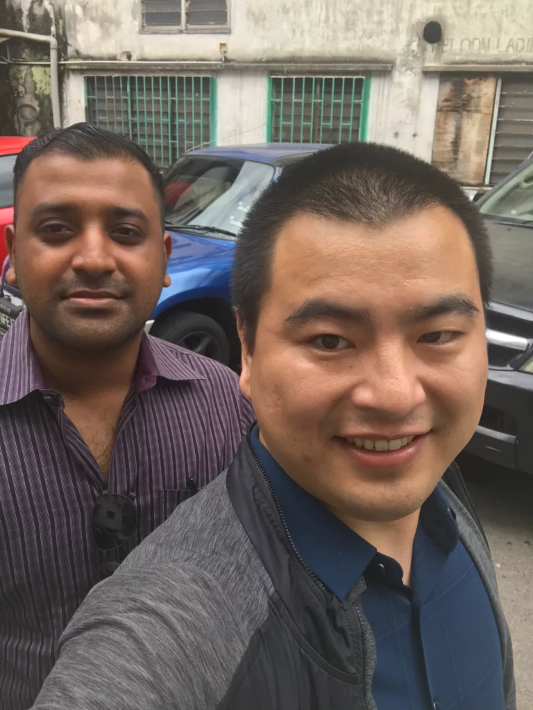 Akicare representative with a business contact outdoors during a visit