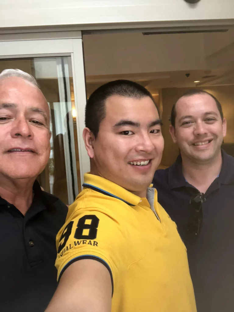 Akicare representative with two business contacts during a visit