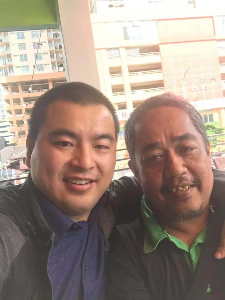Akicare representative with a business contact during an in-person meeting