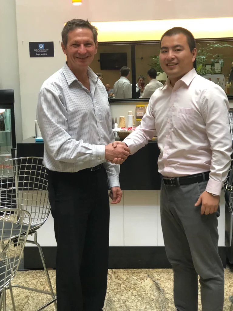 Akicare representative shaking hands with a business contact during a visit