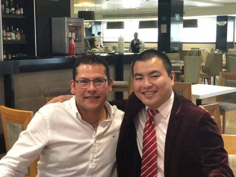 Akicare representative and a business contact at a restaurant table